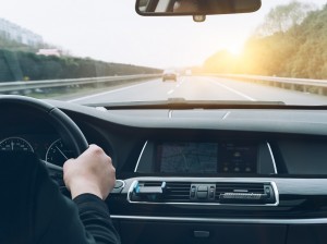 man driving car from rear view