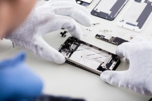 Technician Repairing Mobile Phone