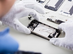 Technician Repairing Mobile Phone