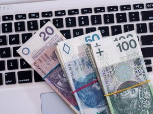 pln polish money on white keyboard laptop