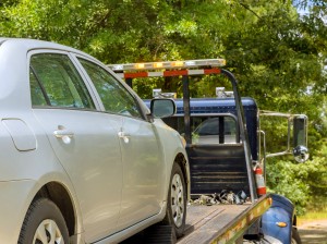 Car service transportation of non working car on a tow truck